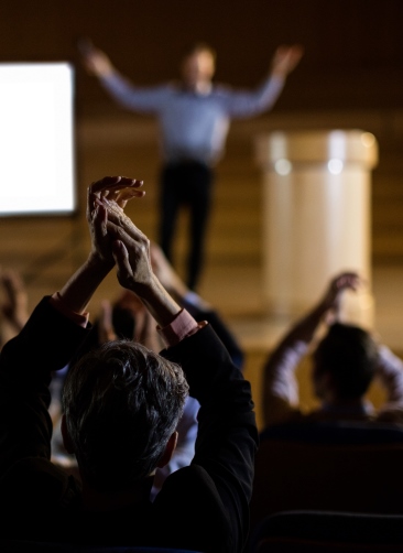 audience-applauding-speaker-after-conference-presentation.jpg